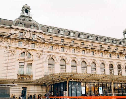 Orsay Museum entrance with visitors in Paris, France.