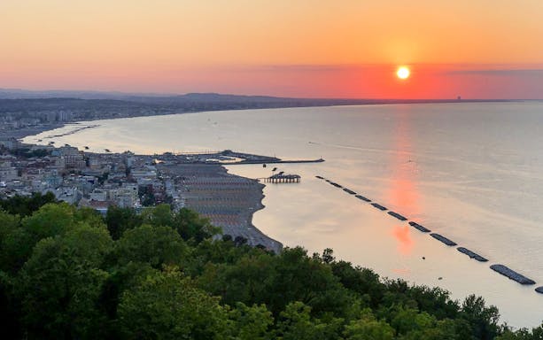 Sunset view over the coastline from San Bartolo Mount during an e-bike picnic.