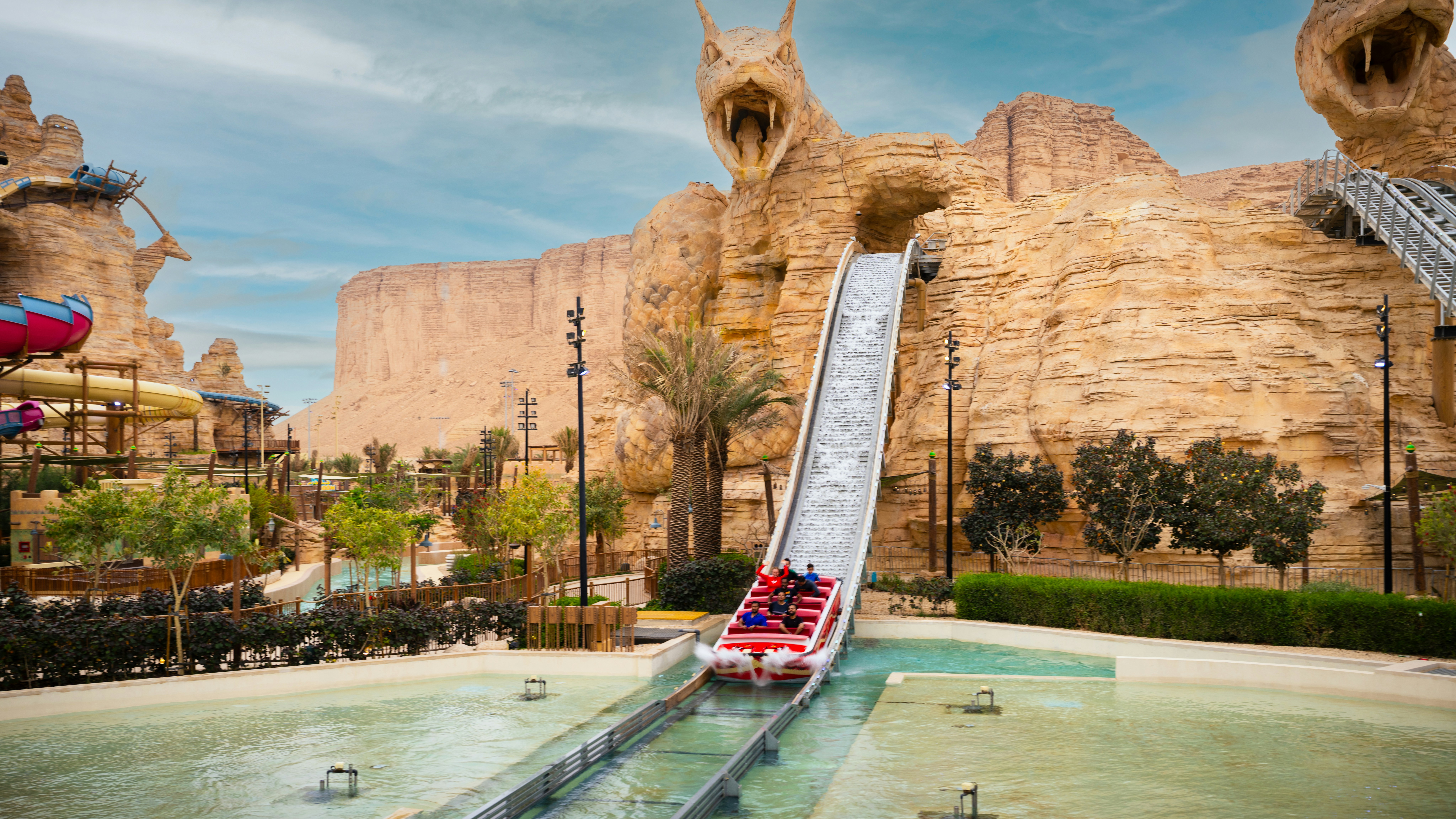 Water ride descending from serpent-themed slide at Aquarabia Water Theme Park, Qiddiya City, Saudi Arabia.