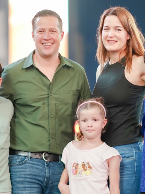 Family posing in Times Square, NYC during a photoshoot.