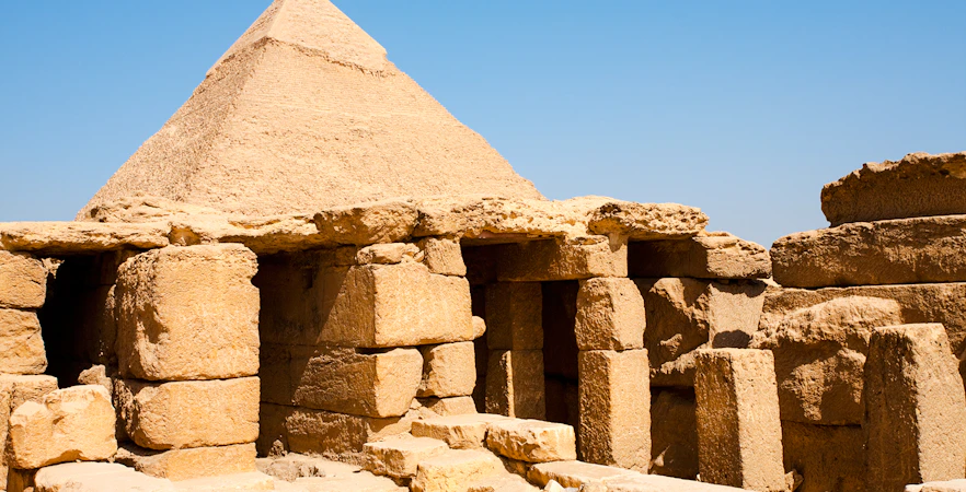 Khafre Pyramid funerary temple ruins in Giza, Egypt, under a clear blue sky.