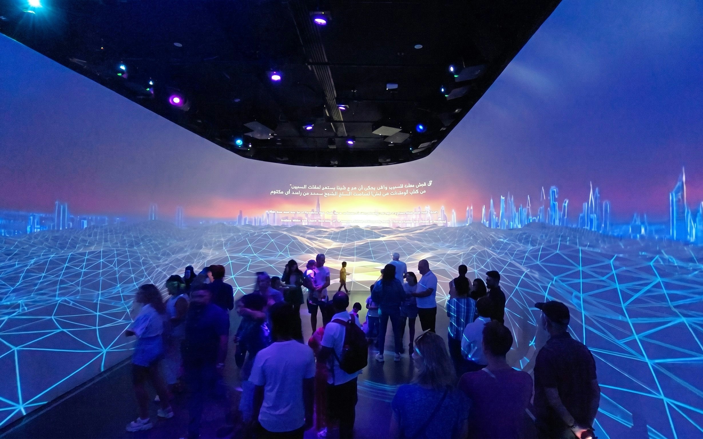 Visitors exploring digital exhibit at Future Museum, Dubai Frame.