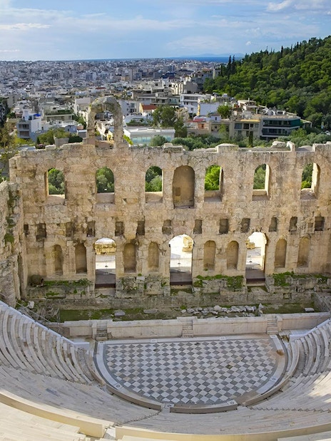 Odeon of Herodes Atticus amphitheater with cityscape view, Athens, Greece.