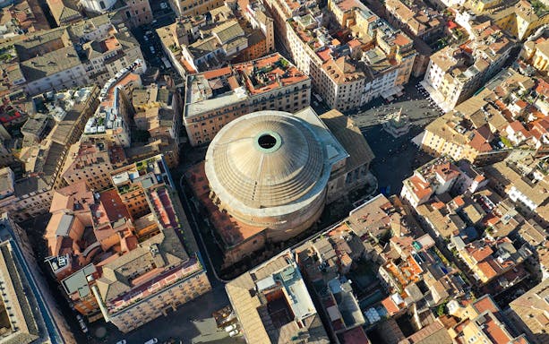 Aerial view of the Roman Pantheon in Rome, Italy, surrounded by historic buildings.