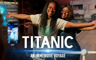 Visitors reenact Titanic scene at immersive exhibit in Houston.