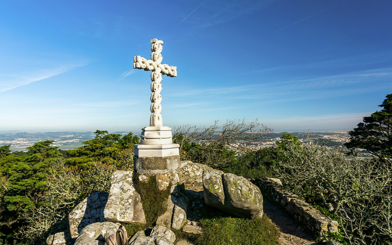Cruz Alta viewpoint overlooking lush Sintra forest near Pena Palace, Portugal.