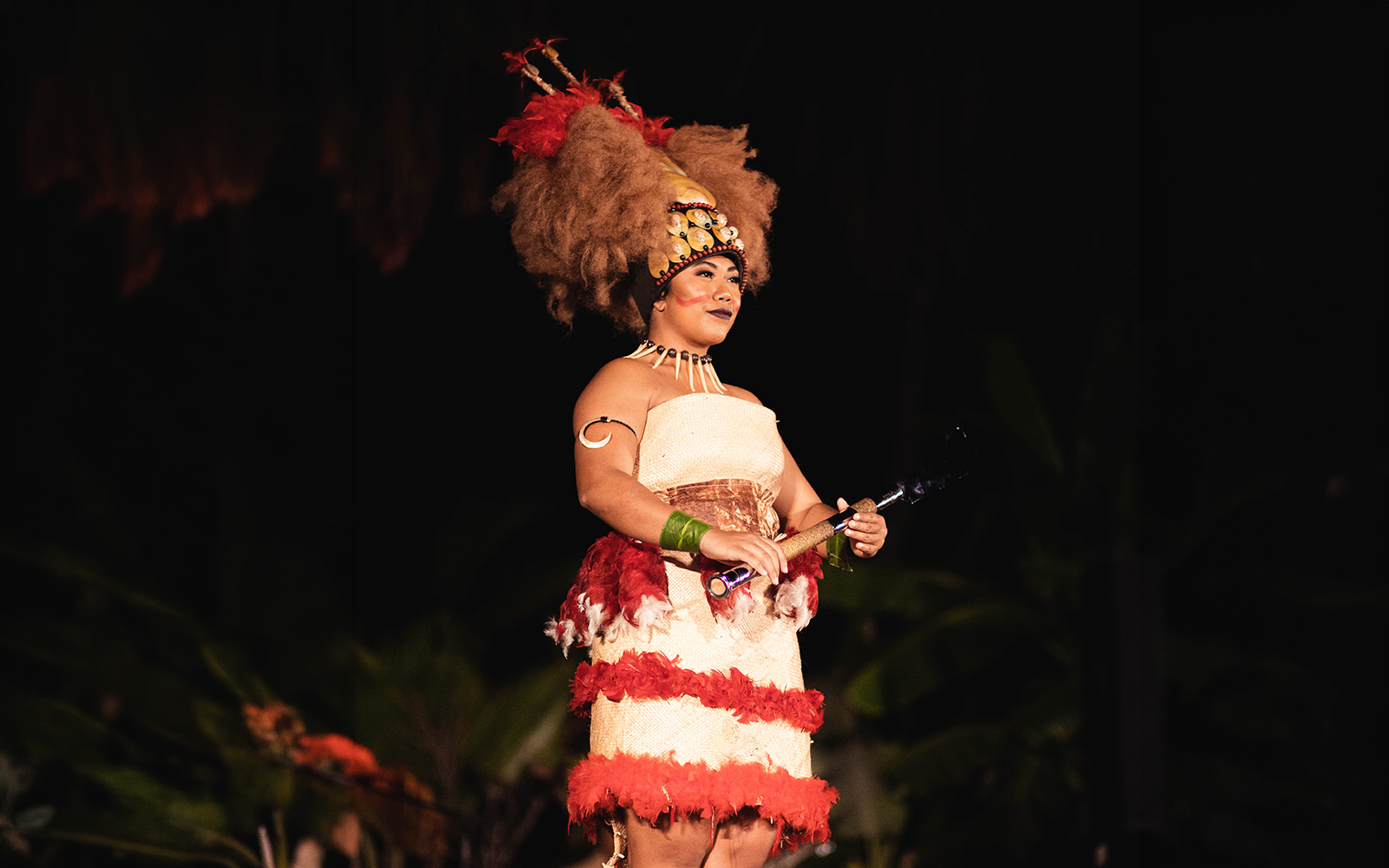 Performer in traditional attire at Chief's Luau, Oahu, Hawaii.