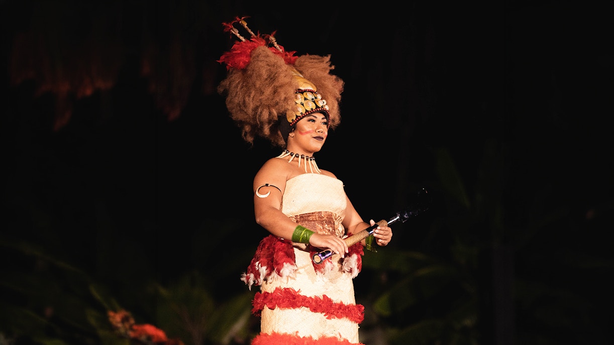 Performer in traditional attire at Chief's Luau, Oahu, Hawaii.