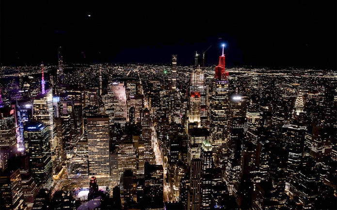 NYC skyline at night from Empire State Building observation deck.