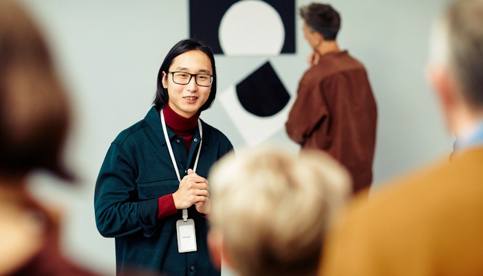 Guide with tour group at Orsay Museum, Paris