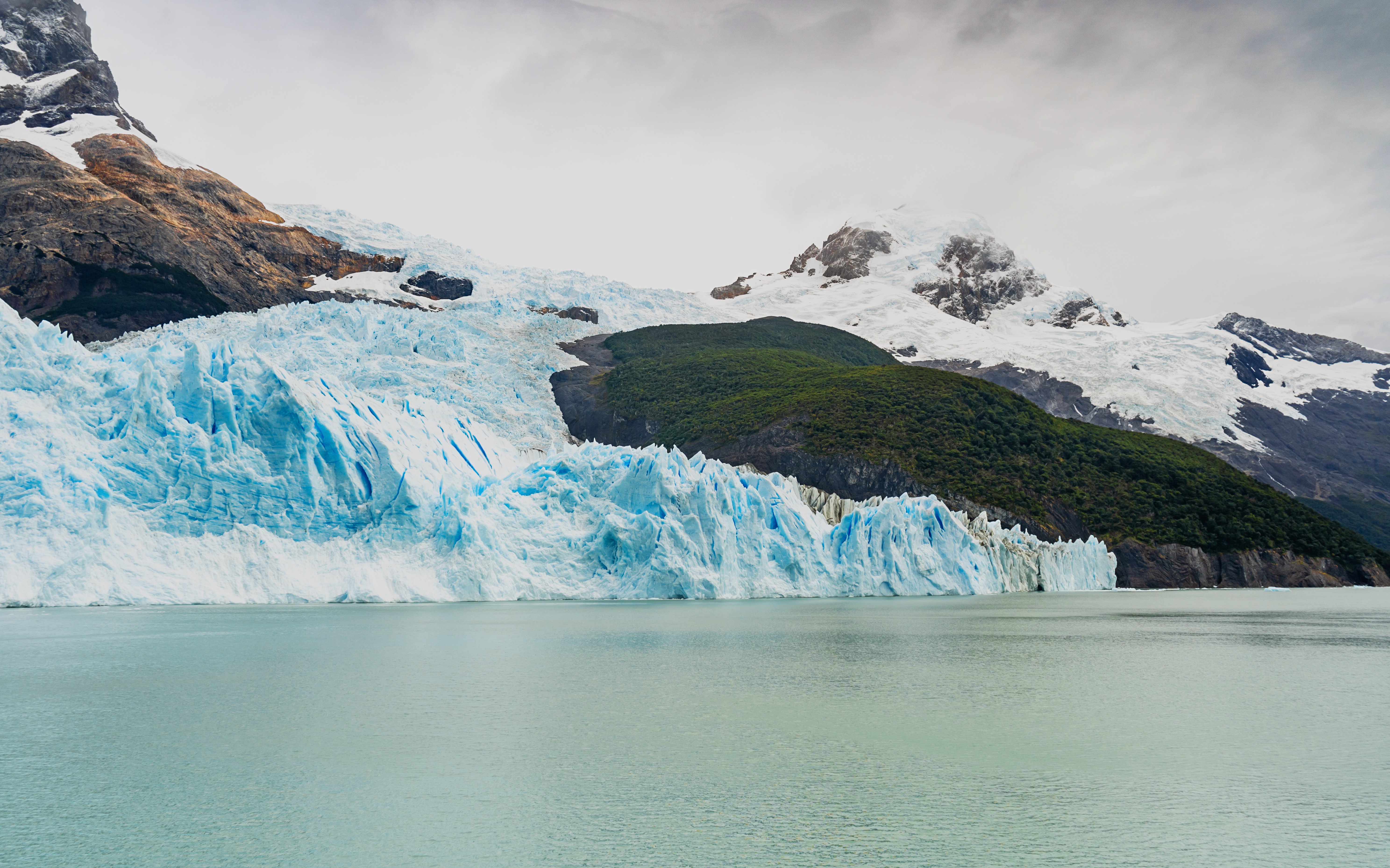 Spegazzini Glacier meeting the water with Peineta and Heim glaciers in the background, Argentina.
