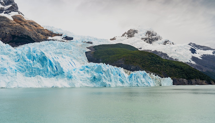 Spegazzini Glacier meeting the water with Peineta and Heim glaciers in the background, Argentina.