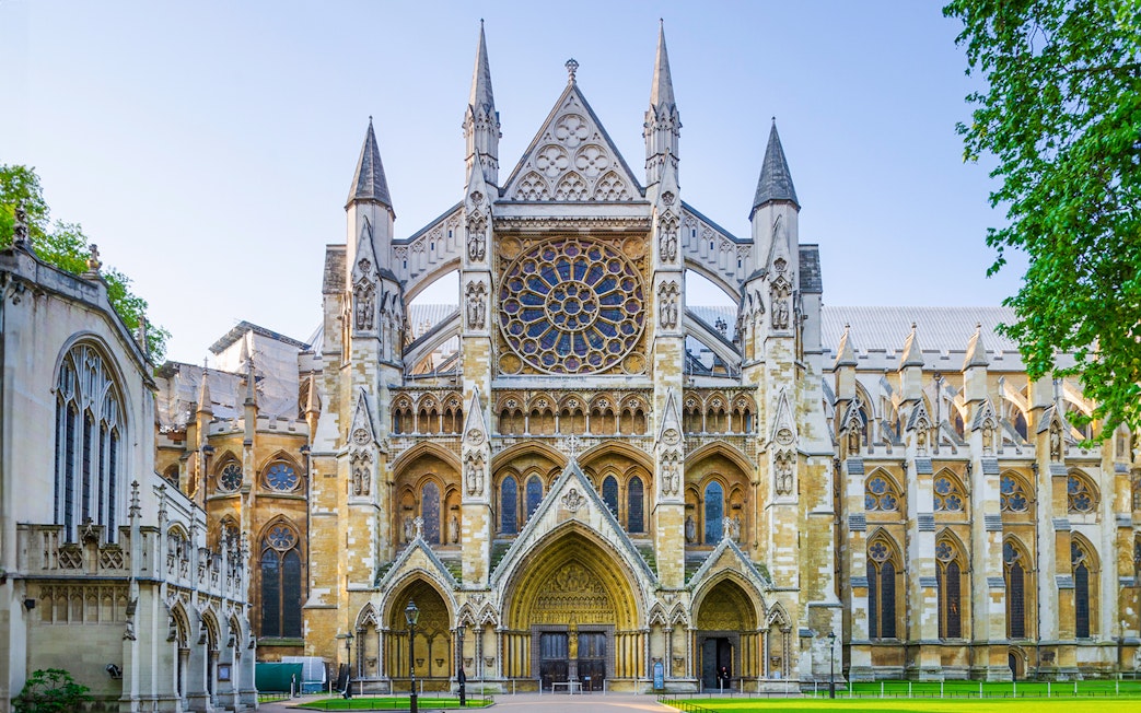 Westminster Abbey facade in London, featuring intricate Gothic architecture.