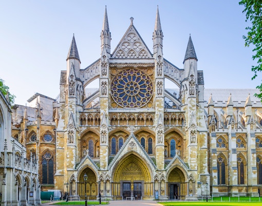 Westminster Abbey facade in London, featuring intricate Gothic architecture.