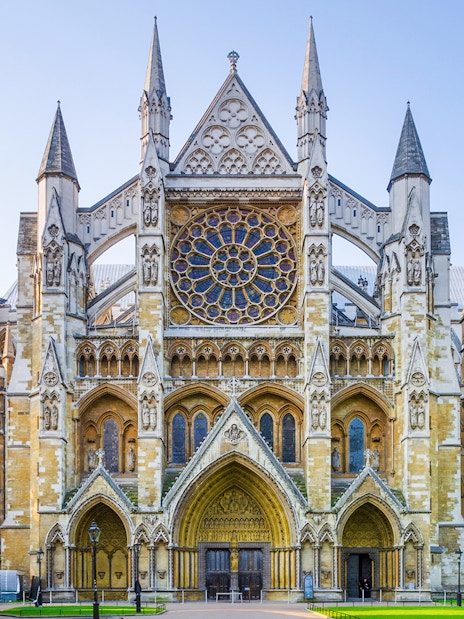 Westminster Abbey facade in London, featuring intricate Gothic architecture.