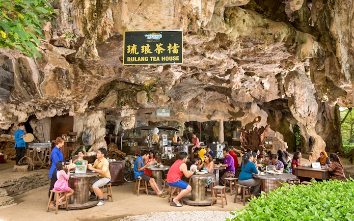 Visitors enjoying tea at Dulang Tea House, Sunway Lost World of Tambun, Malaysia.