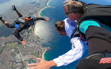 Tandem skydive over Shellharbour, Sydney, with coastal view from 15,000 feet.