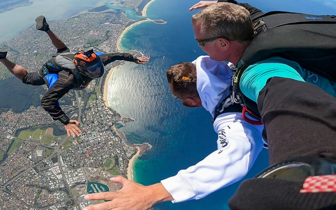 Tandem skydive over Shellharbour, Sydney, with coastal view from 15,000 feet.