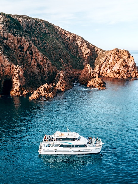 Cruise boat near Cape Woolamai cliffs, Phillip Island, morning view.