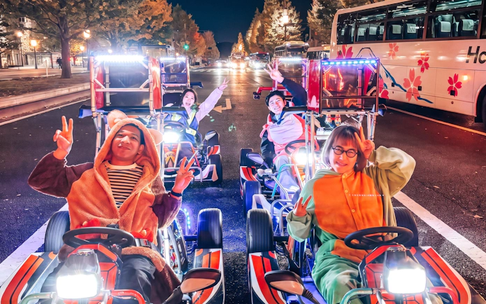 Group enjoying Shibuya Go-Karting Experience by NEO SHIBUYA EDGE at night.