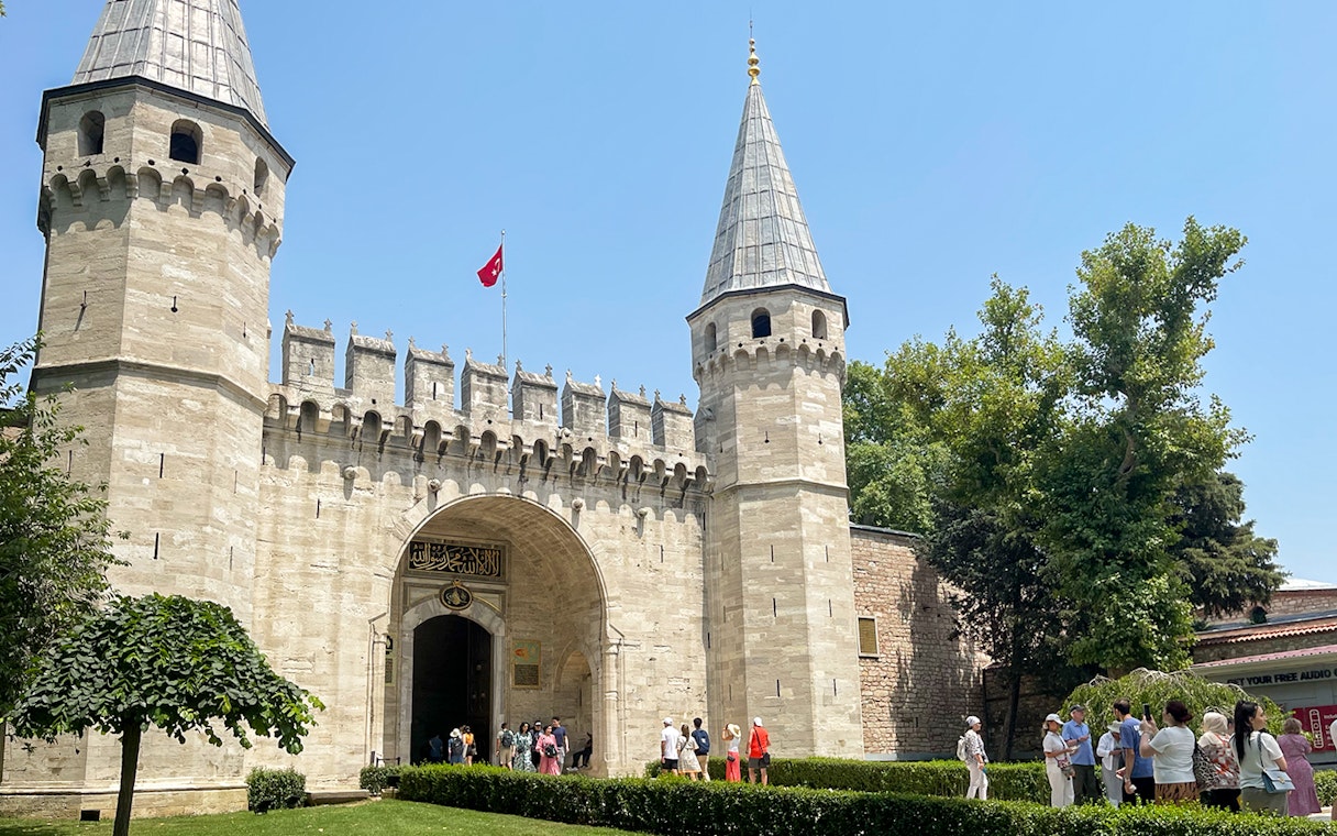Topkapi Palace entrance with tourists in Istanbul, Turkey.
