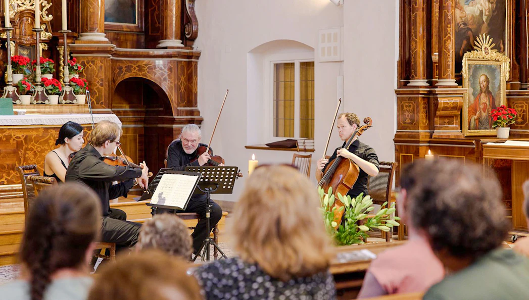 Classical musicians performing at Minoritenkirche, Vienna concert.