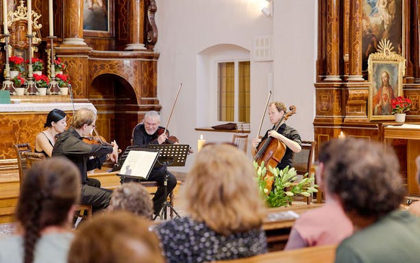 Classical musicians performing at Minoritenkirche, Vienna concert.