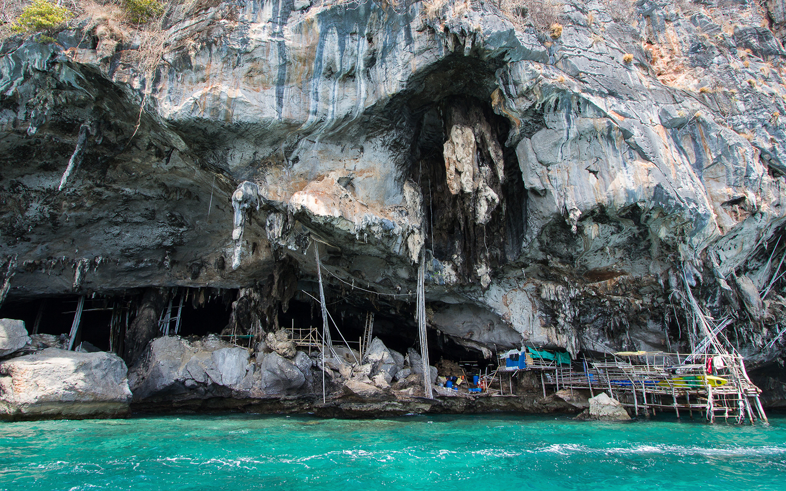 Viking Cave cliffside cavern with ancient paintings and swiftlet bird nests, Thailand.