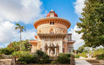 Monserrate Palace in Sintra, Portugal, with ornate architecture and lush gardens.