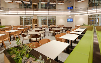 Plaza Premium Lounge interior with seating and greenery, South Korea.