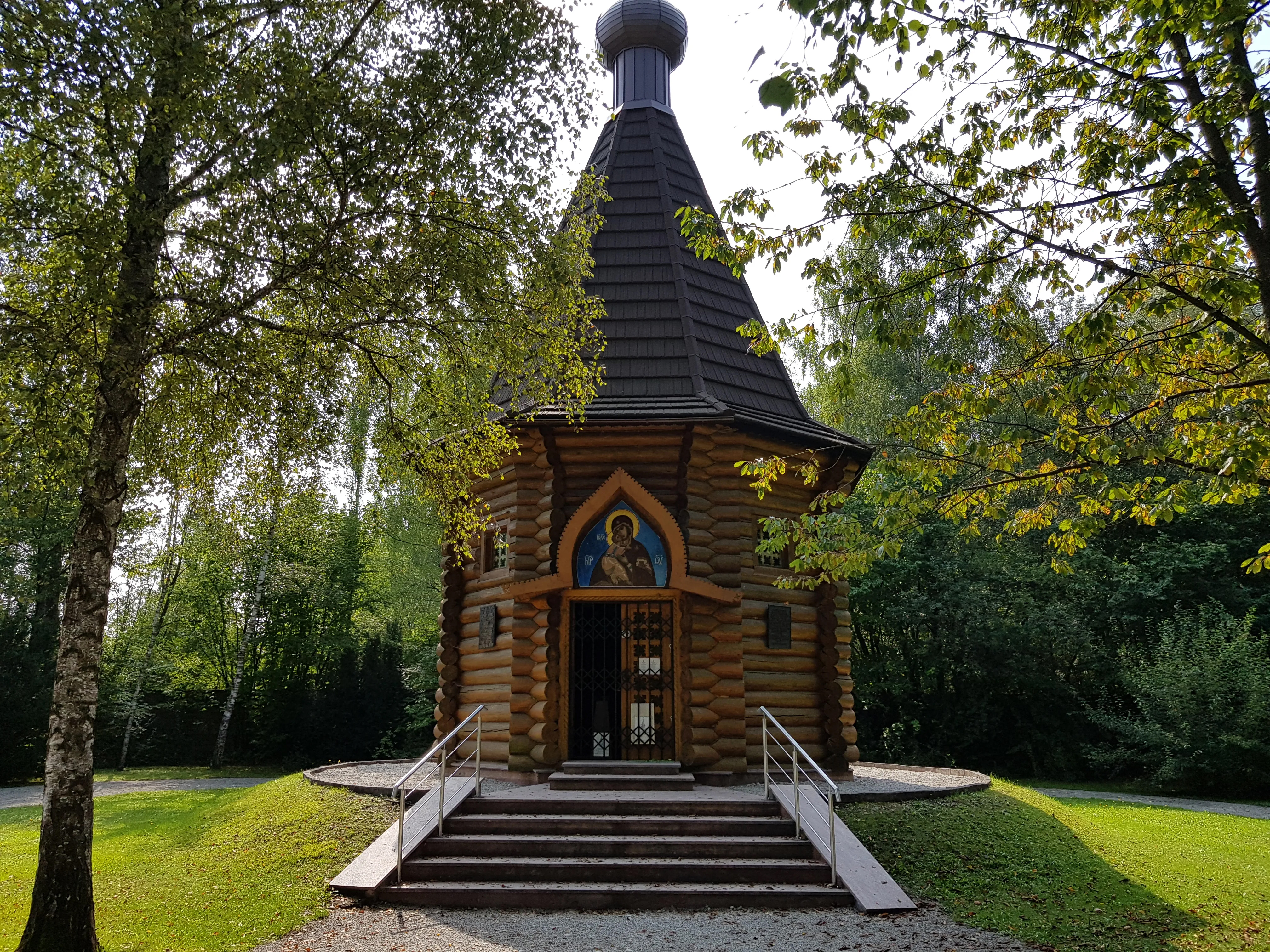 Dachau Concentration Camp memorial site with historical barracks and watchtower in Germany.