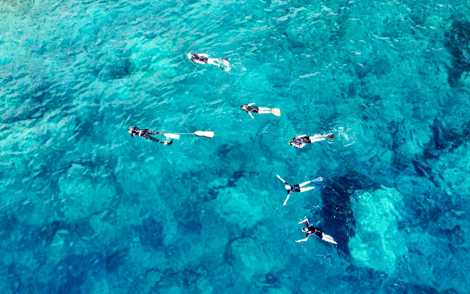 Aerial view of a guided snorkelling tour of the Natural Pools of Molara