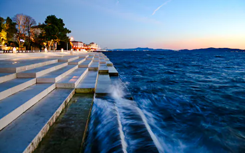 Sea Organ steps by the Adriatic Sea at sunset in Zadar, Croatia.