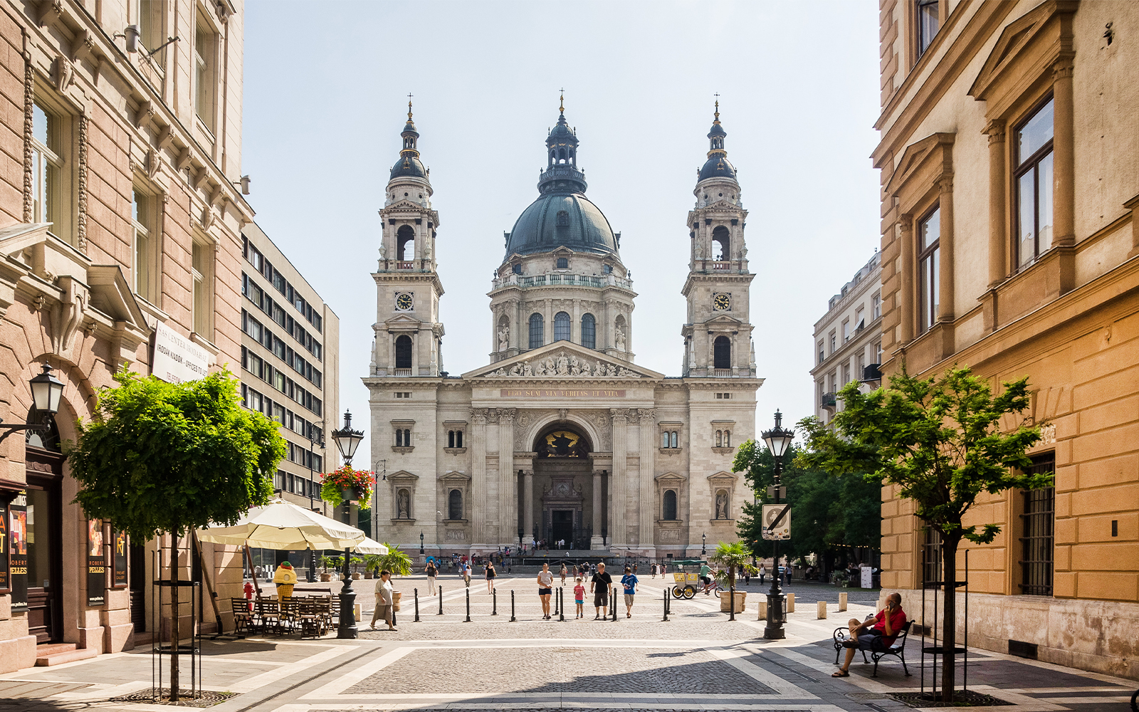 St. Stephen's Basilica facade with surrounding street view in Budapest, Hungary.