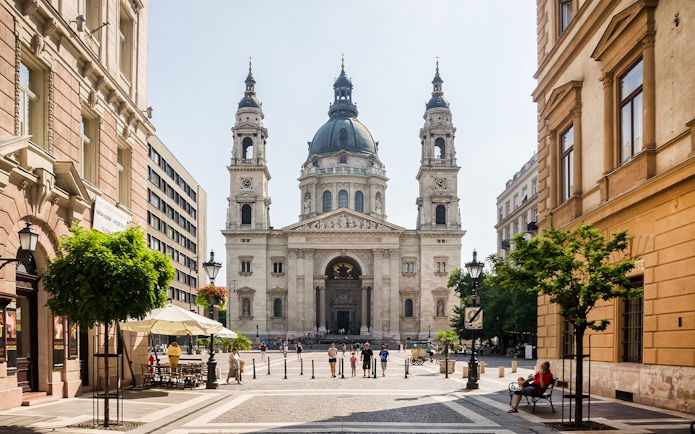 St. Stephen's Basilica facade with surrounding street view in Budapest, Hungary.
