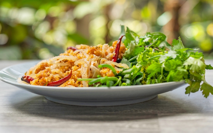 Chiang Mai dish with herbs and spices on a plate.