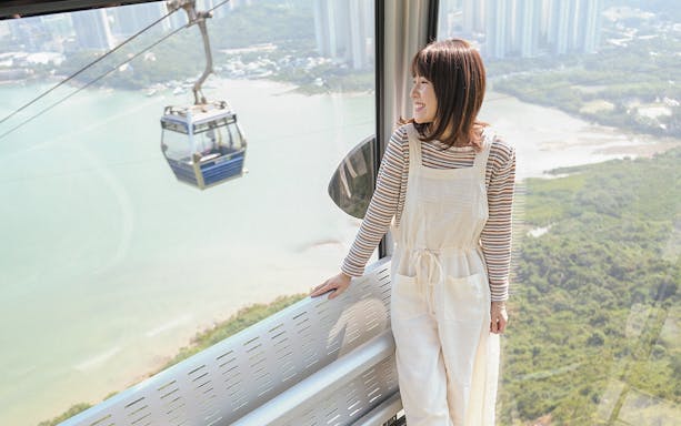 Nong Ping Crystal Plus Cabin with scenic view of Hong Kong landscape.