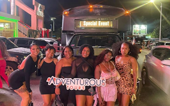 Group enjoying Sint Maarten Party Bus Nightlife Tour with bar stops and shots, New York.