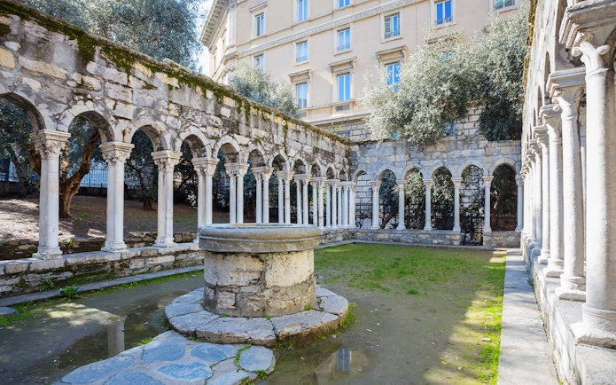 Courtyard with stone arches at Casa di Colombo, Genoa, Italy.
