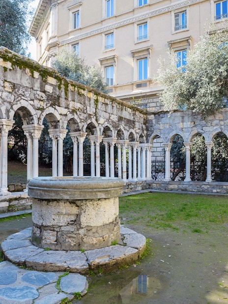 Courtyard with stone arches at Casa di Colombo, Genoa, Italy.