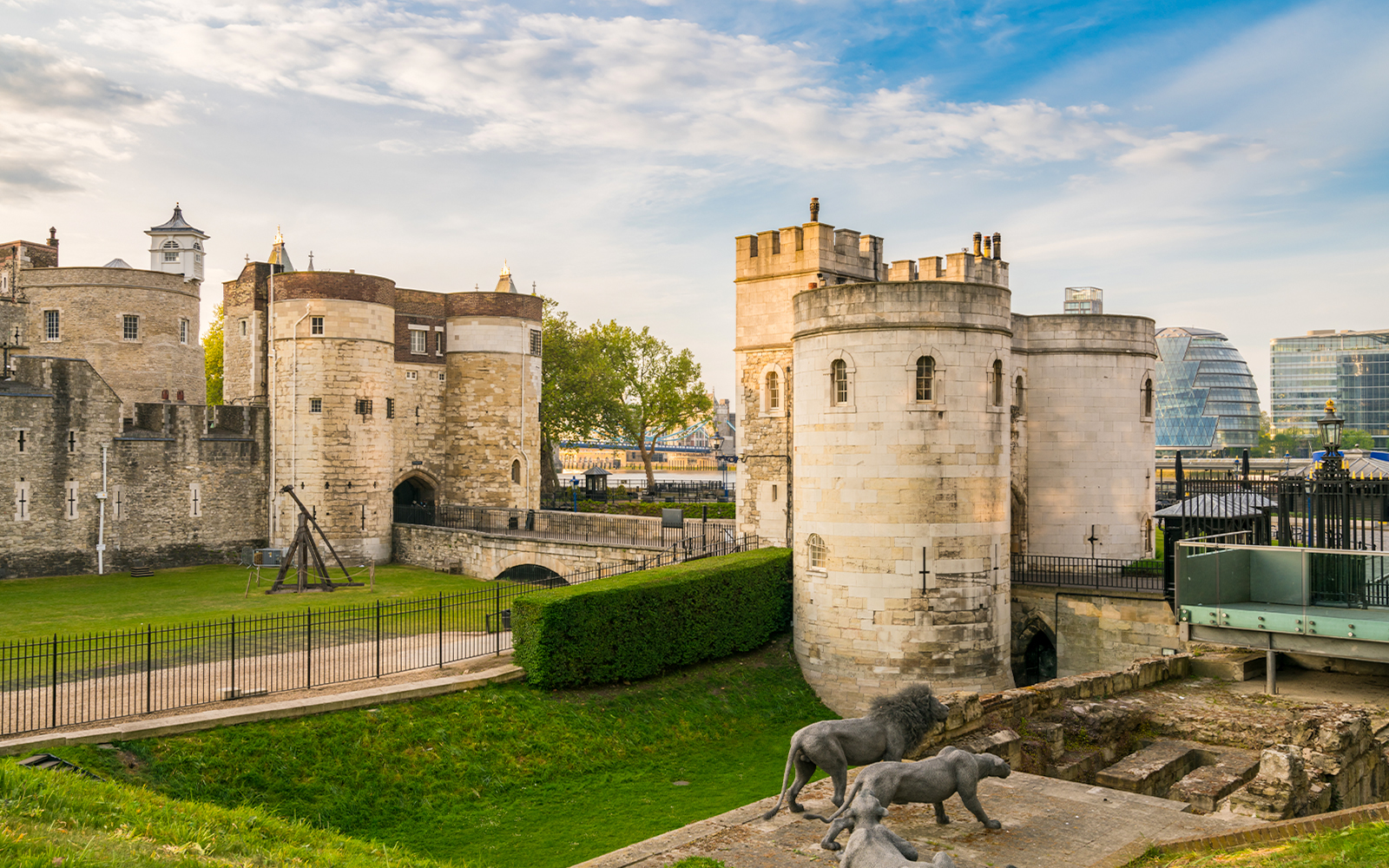 Tower of London courtyard with historic stone walls and sculptures.
