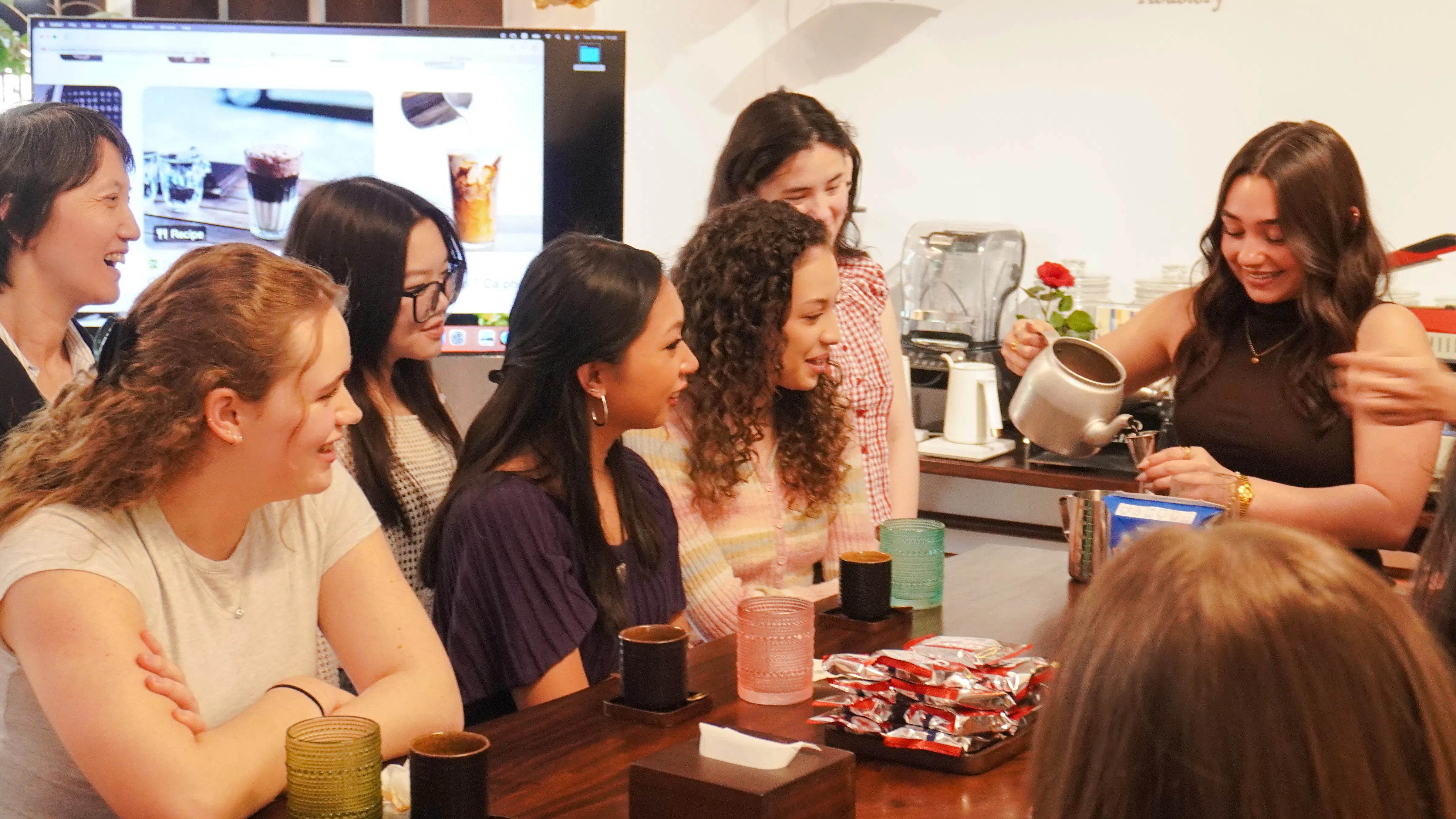 Participants in a Vietnamese coffee class learning brewing techniques in Hanoi.