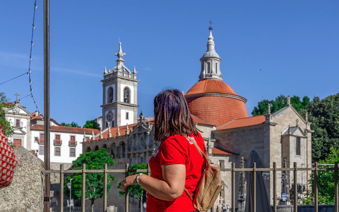 Tourist admiring the Church of Saint Ildefonso in Porto during Douro Historical Tour.