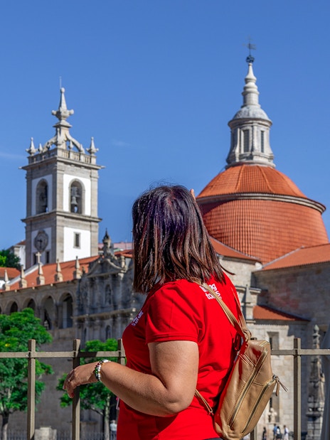 Tourist admiring the Church of Saint Ildefonso in Porto during Douro Historical Tour.