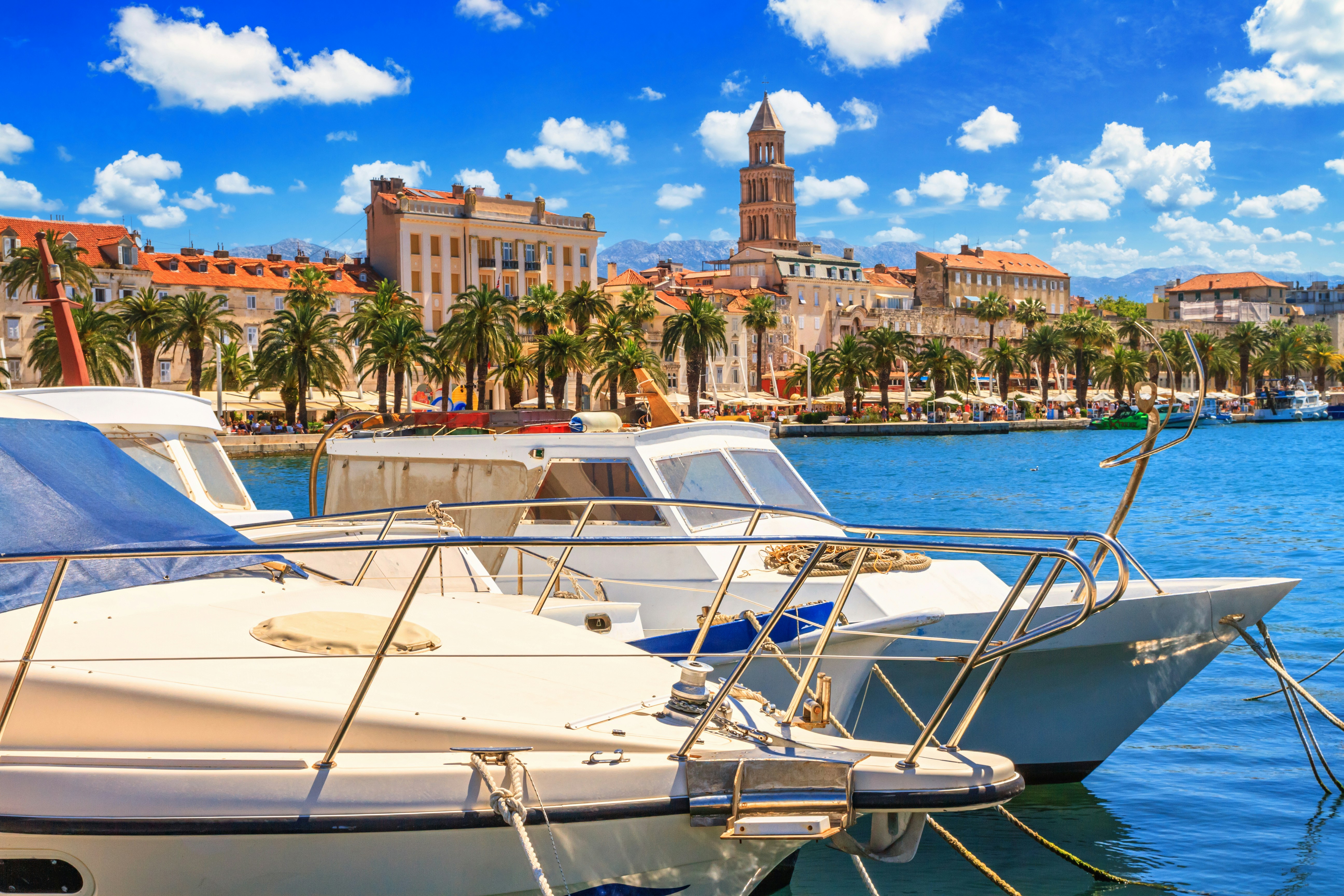 Moored boats with view of Split's Old Town and Adriatic coast, Croatia.