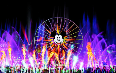 World of Color show with Mickey Ferris wheel at Disneyland Adventure Park, California.