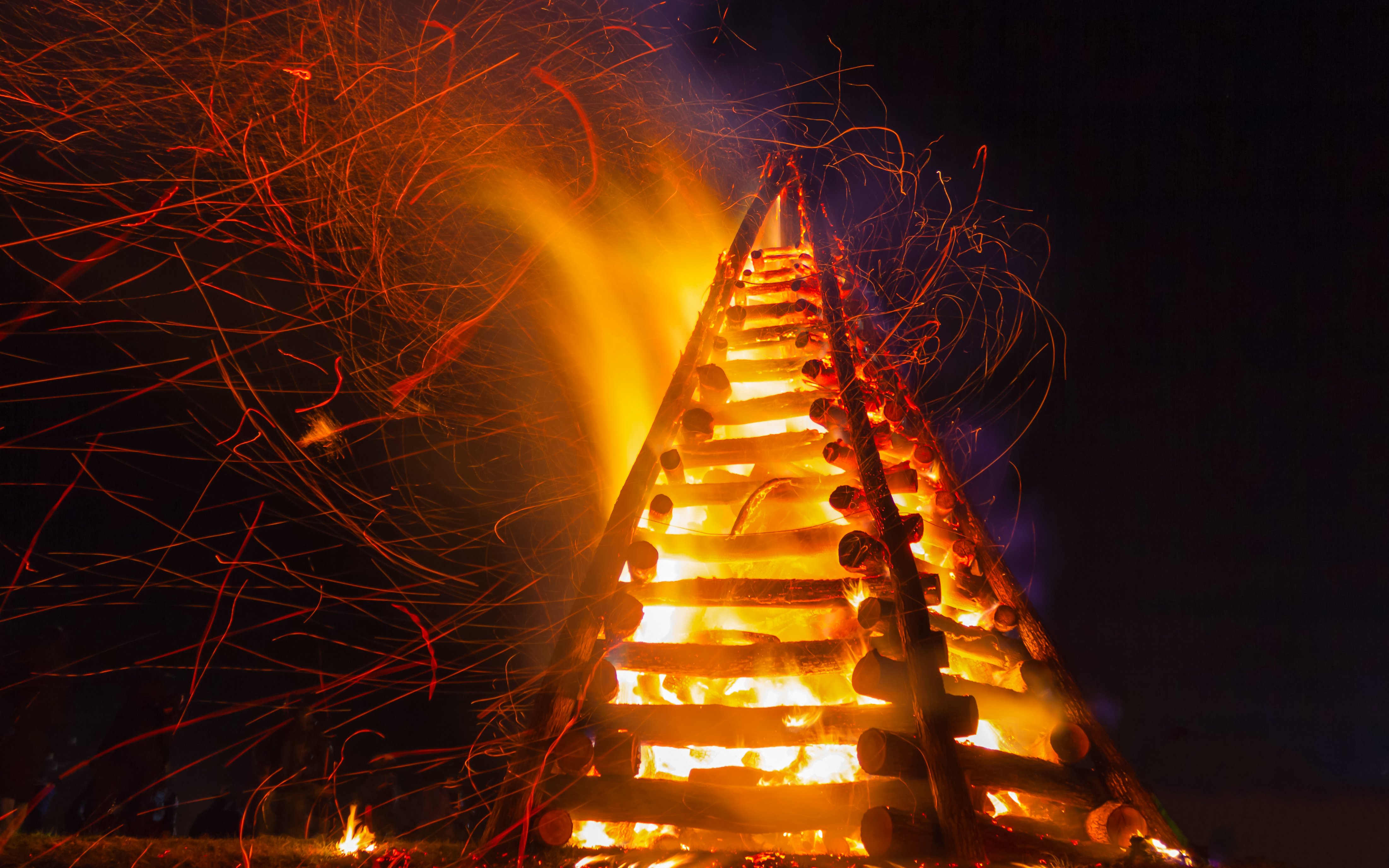 Levee bonfire burning brightly at night in New Orleans.
