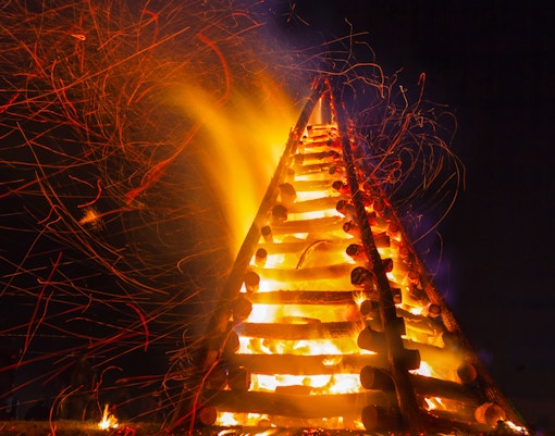 Levee bonfire burning brightly at night in New Orleans.
