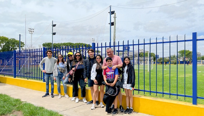 Tourist taking photos outside La Bombonera stadium in Buenos Aires, Argentina.