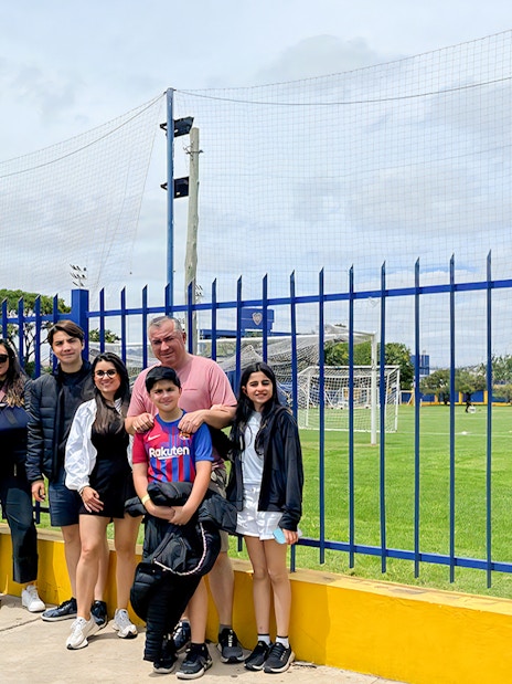 Tourists posing for photos near La Bombonera stadium in Buenos Aires.